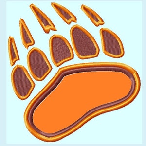 May include: A brown bear paw print with orange fur and a brown outline.