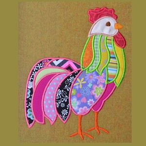 May include: A colorful patchwork rooster applique with pink, green, yellow, and blue fabric pieces. The rooster has a white face and a red comb.