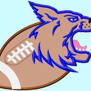 May include: A brown and white football with a blue and brown wolf head design. The wolf is snarling with its mouth open and teeth showing.