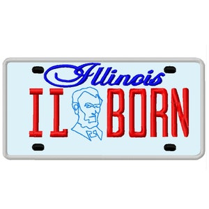 May include: A blue and red Illinois license plate with the text "Illinois" and "I L BORN" and a blue outline of Abraham Lincoln's face.