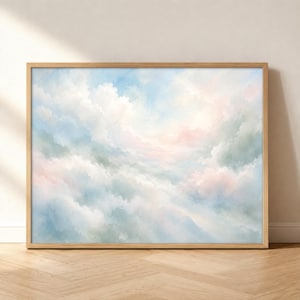 May include: A rectangular wall art piece featuring a soft, painterly depiction of a cloudy sky. The composition displays blended hues of pale blue, white, and subtle hints of pastel pink, framed in a light-toned wooden border.