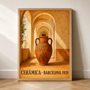 May include: A framed wall art print featuring a terracotta-colored amphora with dark brown decorative patterns, centered in a sunlit stone archway. The bottom of the print displays the black text CERÀMICA · BARCELONA 1929 in a serif font.