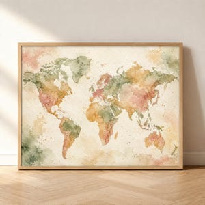 May include: A framed wall art print featuring a world map rendered in a watercolor style. The continents are depicted in soft, blended shades of sage green, muted orange, and dusty pink against a textured, off-white paper background.