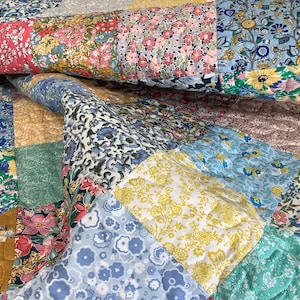 Liberty of London patchwork quilt. Sweet little quilt for a girl or would be great as a little lap quilt. Measures app. 100cm x 112cm