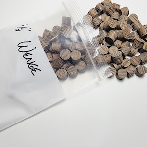 May include: A bag of 1/2 inch wood dowel plugs. The bag is labeled "1/2" Wood" and "Tapped".
