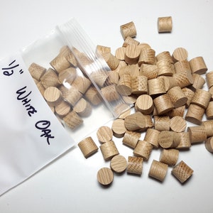 May include: A bag of 1/2 inch white oak dowels. The bag is labeled "1/2" White Oak" and "Tapered". The dowels are scattered on a white surface.