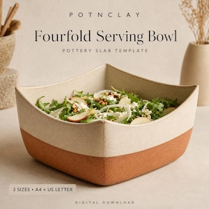 May include: A square ceramic serving bowl with a two-tone design featuring a speckled cream upper section and a solid terracotta base. The bowl is filled with a salad of greens, sliced pears, and cheese. Text reads: POTNCLAY Fourfold Serving Bowl.