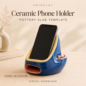 May include: A blue and yellow ceramic phone holder with a terracotta-colored base opening and a small side compartment. The text reads POTNCLAY, Ceramic Phone Holder, POTTERY SLAB TEMPLATE, 3 SIZES, A4 + US LETTER, and DIGITAL DOWNLOAD.