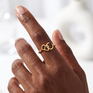 Create a truly personal statement piece with this custom two letter ring, designed to showcase two initials, a monogram, or your own custom logo in a timeless solid gold design. Whether you want to represent two meaningful initials, a couple's letters, a family monogram or your personal brand, this personalized initial ring transforms your idea into a unique piece of jewelry.