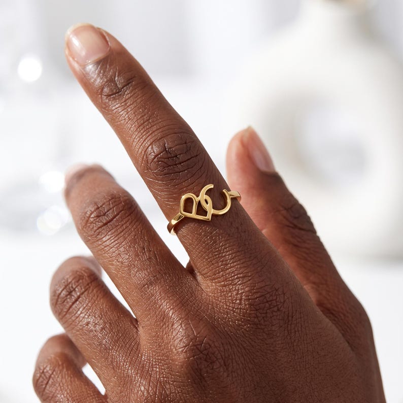 Create a truly personal statement piece with this custom two letter ring, designed to showcase two initials, a monogram, or your own custom logo in a timeless solid gold design. Whether you want to represent two meaningful initials, a couple's letters, a family monogram or your personal brand, this personalized initial ring transforms your idea into a unique piece of jewelry.