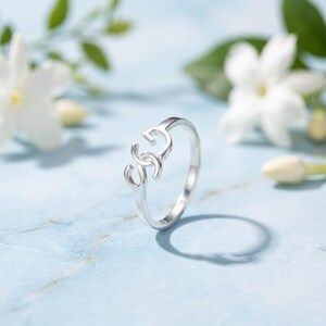 Create a truly personal statement piece with this custom two letter ring, designed to showcase two initials, a monogram, or your own custom logo in a timeless solid gold design. Whether you want to represent two meaningful initials, a couple's letters, a family monogram or your personal brand, this personalized initial ring transforms your idea into a unique piece of jewelry.