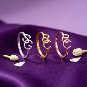 Create a truly personal statement piece with this custom two letter ring, designed to showcase two initials, a monogram, or your own custom logo in a timeless solid gold design. Whether you want to represent two meaningful initials, a couple's letters, a family monogram or your personal brand, this personalized initial ring transforms your idea into a unique piece of jewelry.