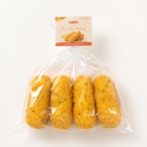 May include: Four golden-brown, breaded, cylindrical food items packaged in a clear plastic bag. A rectangular label at the top features the text "freshly baked" in a script font, along with an illustration of the food items and green herbs.