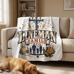 May include: A white throw blanket featuring a graphic print of a utility pole, lightning bolts, and the text LINEMAN FAMILY. The design includes a hard hat, a pair of work gloves, and a silhouette of a family of four with a heart symbol.