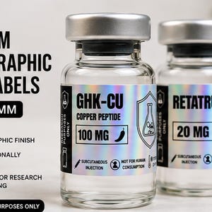 May include: Two clear glass vials with silver caps featuring custom holographic labels. The labels display text including GHK-CU, COPPER PEPTIDE, 100 MG, RETATRUTIDE, 20 MG, and the dimensions 40 x 20 mm. The labels also include various icons and warnings.
