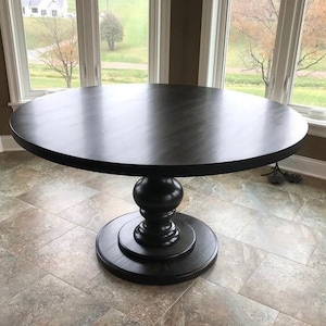 Black pedestal dining on sale table with leaf