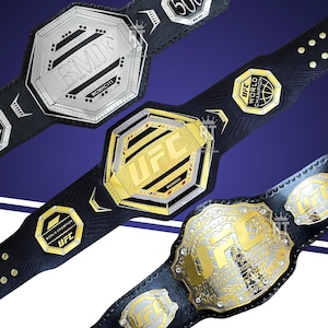 Può includere: Tre cinture da campionato con cinturini in pelle nera. La cintura superiore è argentata con la scritta BMF. La cintura centrale è dorata con la scritta UFC. La cintura inferiore è dorata e argentata con la scritta UFC Ultimate Fighting Championship.