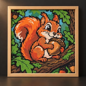 May include: A square cross-stitch embroidery featuring a bright orange squirrel with a large bushy tail holding a brown acorn. The squirrel is perched on a brown tree branch surrounded by green oak leaves against a light blue sky background.