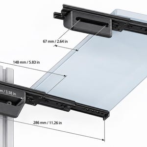 May include: A black metal mounting bracket system with a clear glass shelf, featuring labeled dimensions of 67 mm / 2.64 in, 148 mm / 5.83 in, 91 mm / 3.58 in, and 286 mm / 11.26 in. The assembly includes sliding rails and a vertical support beam.