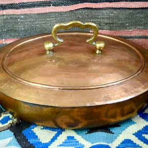 Vintage copper casserole with lid...oval covered copper casserole...tin lined copper casserole...hammered copper...brass handles.