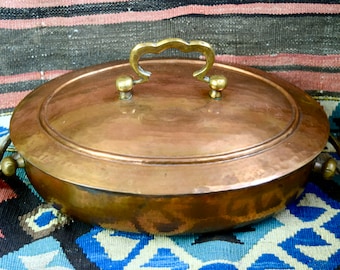 Vintage copper casserole with lid...oval covered copper casserole...tin lined copper casserole...hammered copper...brass handles.