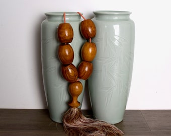 Vintage Japanese celadon vases...pair of carved vases, featuring bamboo...12" tall.