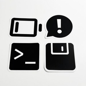 May include: Four black and white stickers featuring digital icons: a battery symbol, a speech bubble with an exclamation point, a command line prompt with a greater-than sign and underscore, and a floppy disk icon with a square tab.