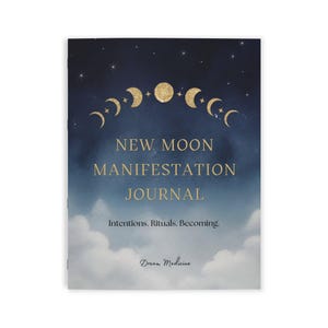 May include: A journal with a dark blue night sky cover featuring gold moon phases, stars, and white clouds. The text reads: NEW MOON MANIFESTATION JOURNAL, Intentions. Rituals. Becoming., and Dream Medicine in a script font at the bottom center.