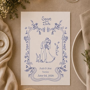 May include: A rectangular white Save the Date card featuring blue line art of a couple and two cats inside a floral border. The text reads Save the Date, Josh & Jess, Tuesday, June 04, 2026. The design includes intricate vines and flowers.