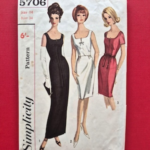May include: A Simplicity sewing pattern envelope labelled 5706, size 14, bust 34. The front features illustrations of three dresses: a floor-length black gown, a knee-length white dress with a small bow, and a knee-length red dress with a waist tie.