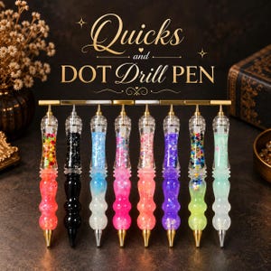 May include: Eight dot drill pens arranged in a row, each featuring a clear acrylic barrel filled with colourful glitter, sequins, or solid pigments. The pens have metallic tips and top accents, with the text Quicks and DOT Drill PEN above.