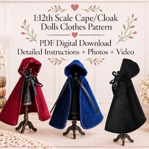 May include: A 1:12th scale cape and cloak dolls clothes pattern PDF digital download with detailed instructions, photos, and video. Three miniature capes in red, blue, and black velvet fabric are displayed on small stands with black ribbon ties.