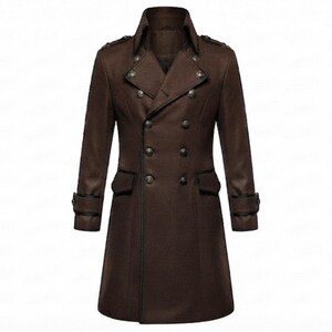 May include: A dark brown double-breasted coat featuring a wide lapel, structured shoulders, and epaulettes. The garment includes two rows of metallic buttons, two flap pockets at the waist, and adjustable buckled straps on each long sleeve cuff.