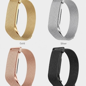 May include: Four metal mesh watch bands in gold, silver, rose gold, and black. Each band features a rectangular metal loop connector and a fine woven texture. The labels Gold, Silver, Rose Gold, and Black are printed below each respective band.