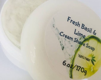 May include: A white, open container of cream shave soap. The label reads "Fresh Basil & Lime Cream Shave Soap" with a lime slice graphic. The container holds 6.0 oz (170g) of product.