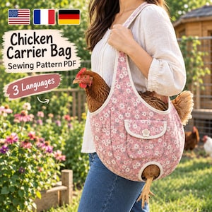 May include: A pink fabric carrier bag with a white floral pattern, designed for transporting a chicken. The bag features a small front pocket with a flower-shaped button, a wide shoulder strap, and a circular opening at the bottom for legs.