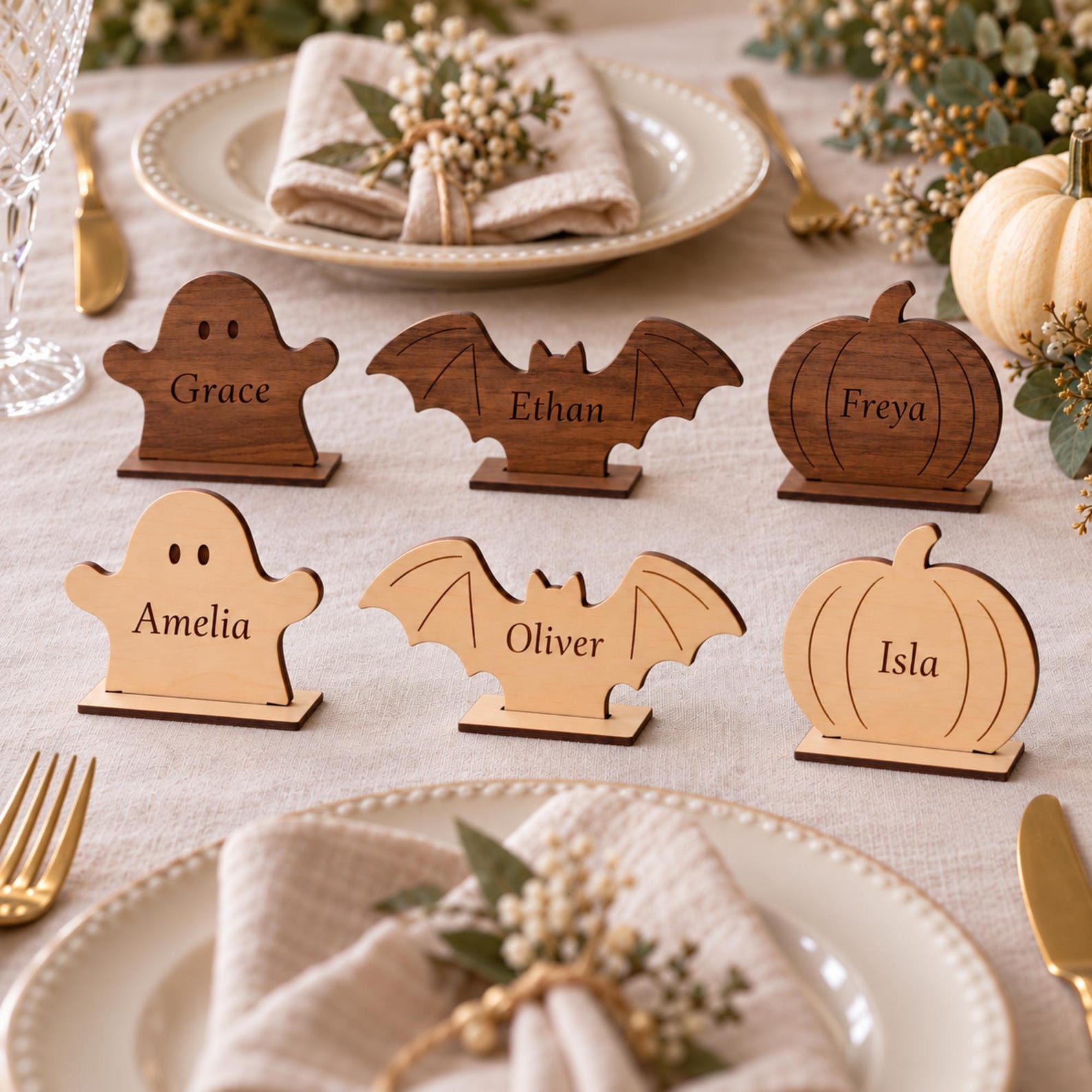 An Engraved Wooden Bat or Pumpkin Wooden Halloween place names in ghost, bat, pumpkin and other character shapes.