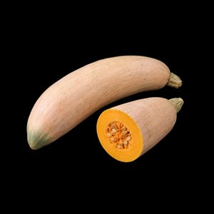 May include: A whole light tan butternut squash positioned diagonally next to a cross-section of the same squash, revealing a bright orange interior flesh with visible seeds and a smooth, pale beige outer skin against a solid black background.