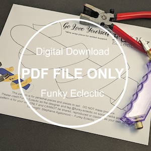 May include: A printable PDF pattern for a wire-wrapped "Go Love Yourself" design. The pattern is outlined in black on a white background. The text "Digital Download" and "PDF File Only" are also included. The image includes tools for wire wrapping, such as a pair of pliers and a glass cutter.