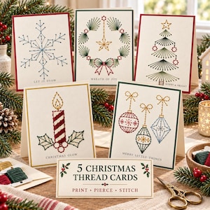 May include: Five greeting cards featuring embroidered holiday designs including a snowflake, wreath, tree, candle, and ornaments. Each card displays text such as Let It Snow, Wreath of Joy, Merry & Bright, Christmas Glow, and Merry Little Things.