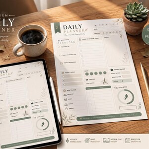May include: A daily planner template displayed on a tablet screen and a printed sheet of paper. The layout includes sections for daily goals, water intake, meal tracking, money tracking, and a mood tracker, all featuring sage green accents and text.