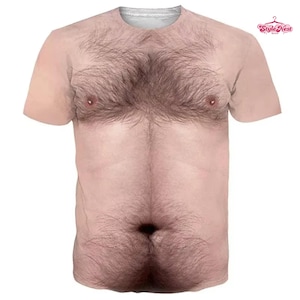 May include: A short-sleeve crew neck t-shirt featuring a realistic, high-definition photographic print of a bare human torso with dark chest and abdominal hair. The design includes a navel and two nipples, covering the entire front of the garment.