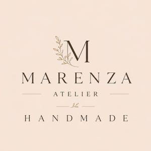 May include: A logo design on a pale pink background featuring a large letter M with a delicate leafy branch illustration. Below the M, the text reads MARENZA, followed by ATELIER, a small leaf icon, and the word HANDMADE in capital letters.