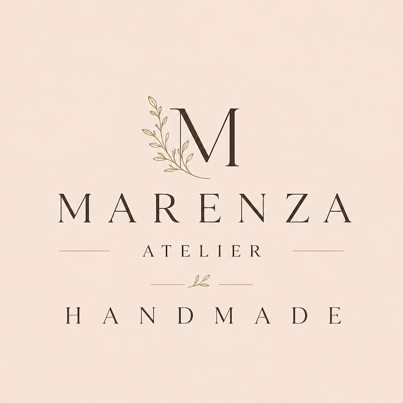 May include: A logo design on a pale pink background featuring a large letter M with a delicate leafy branch illustration. Below the M, the text reads MARENZA, followed by ATELIER, a small leaf icon, and the word HANDMADE in capital letters.