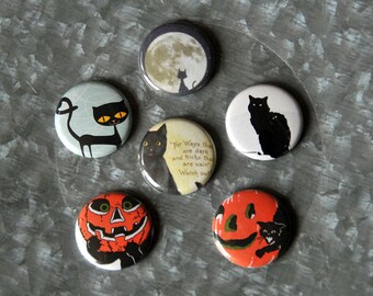 May include: Six round black and white buttons with various Halloween-themed images. The buttons feature black cats, pumpkins, and a full moon. One button has the text "For Ways that are dark and tricks that are vain. Watch out!"
