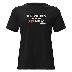 May include: A black short-sleeved t-shirt featuring white text that reads THE VOICES HAVE AN, with the word API in orange, and the word NOW in white. Below this, a small white rectangular box contains the text deathlovesdash.