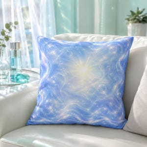 May include: A square throw pillow featuring a vibrant blue and white abstract design with swirling patterns, glowing light effects, and scattered star-like sparkles. The center of the pillow displays a bright, radiating light source.
