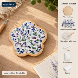 May include: A flower-shaped wooden base with ceramic mosaic pieces, a mixing bowl, stir stick, glue, grout powder, and a sponge. The mosaic features blue, green, and pink floral patterns. The set includes text labels and a size of 6.5 x 3.0 inches.