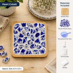 May include: A rectangular wooden base featuring a mosaic design of blue and white floral ceramic pieces. The kit includes a wooden base, ceramic mosaic pieces, a blue mixing bowl with a stir stick, glue, grout powder, and a sponge. Size is 4.3 x 3.5 inches.