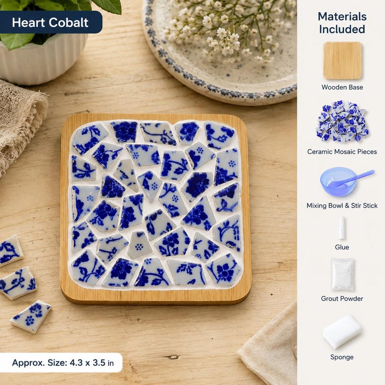 May include: A rectangular wooden base featuring a mosaic design of blue and white floral ceramic pieces. The kit includes a wooden base, ceramic mosaic pieces, a blue mixing bowl with a stir stick, glue, grout powder, and a sponge. Size is 4.3 x 3.5 inches.